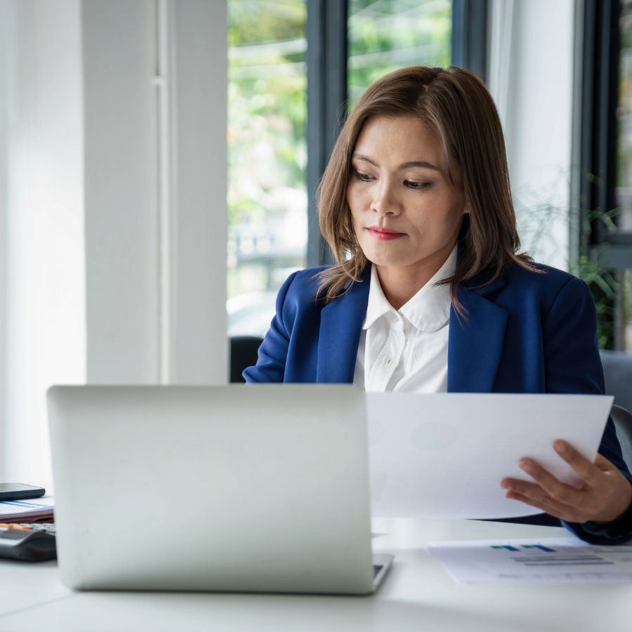 UK business owner reviewing business loan funding paperwork